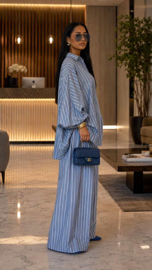 Side view of dusty blue striped two-piece set with flowing sleeves