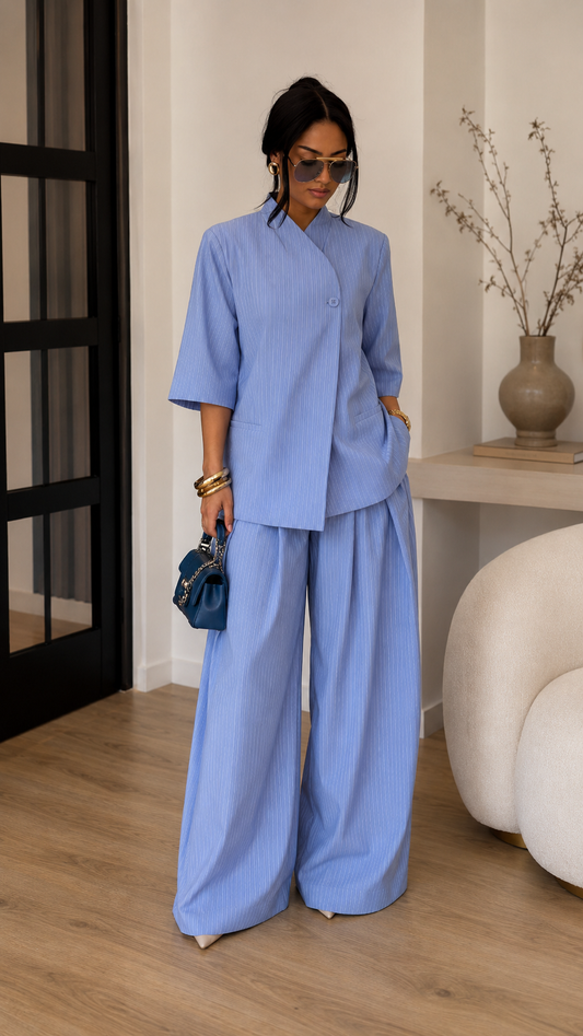 Full body view of sky blue matching set with three-quarter sleeve top and flowing pants