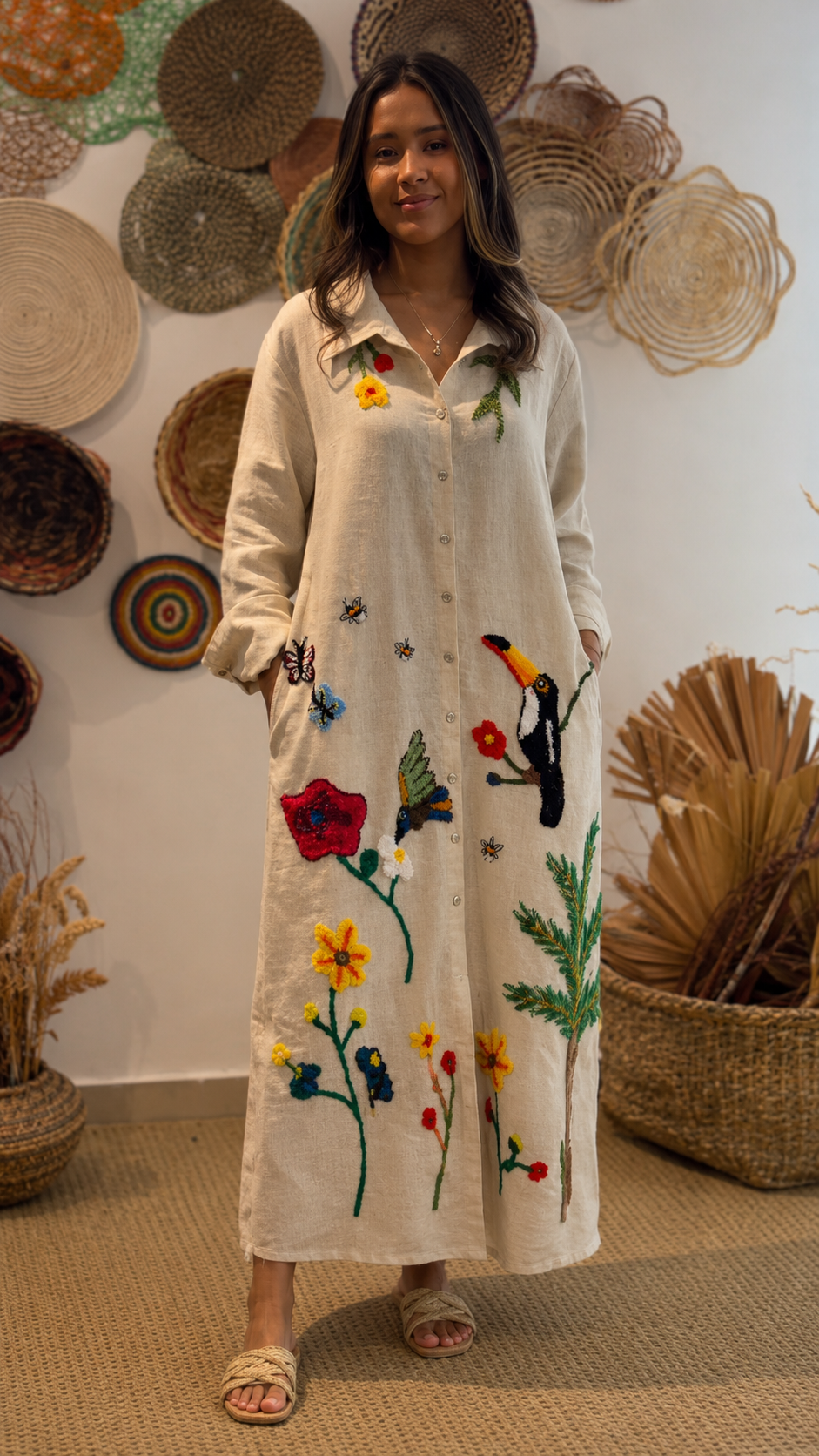 Front view of beige embroidered floral shirt maxi dress with long sleeves and colorful bird motif