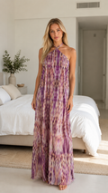 Front view of purple abstract print halter backless maxi dress
