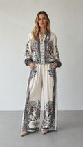 Front view of ivory paisley print matching set with zip-front top and wide-leg pants