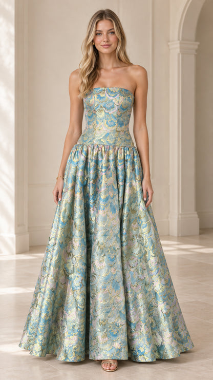 Front view of model wearing strapless floral jacquard maxi ball gown in aqua blue