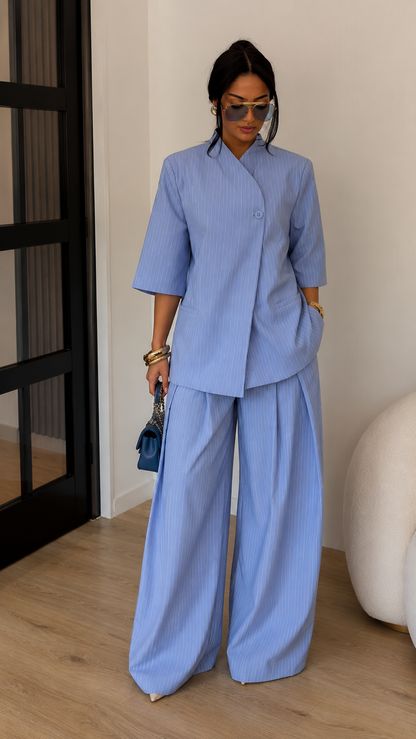 Front view of sky blue textured two-piece set with wrap-look top and wide-leg pants