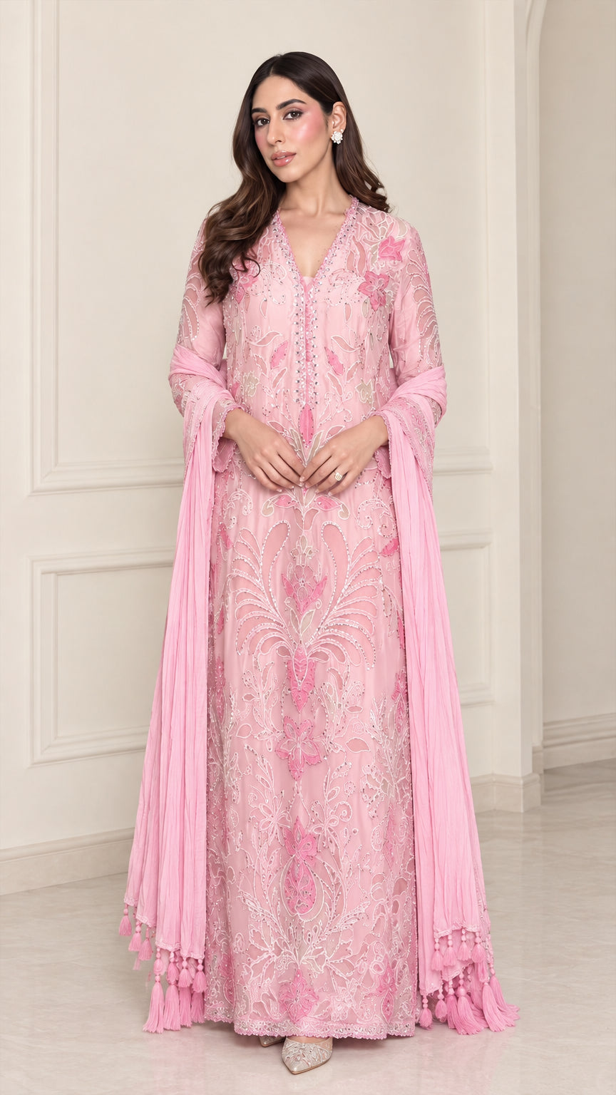 Front full-length view of model in light pink floral embroidered maxi dress with matching scarf