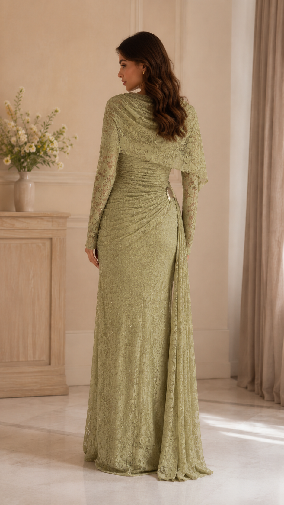 Back view of sage lace maxi evening dress with long sleeves and draped cape overlay