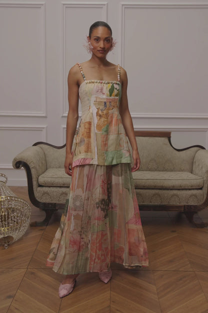 Front view of pastel floral patchwork maxi dress with beaded straps and flowing skirt