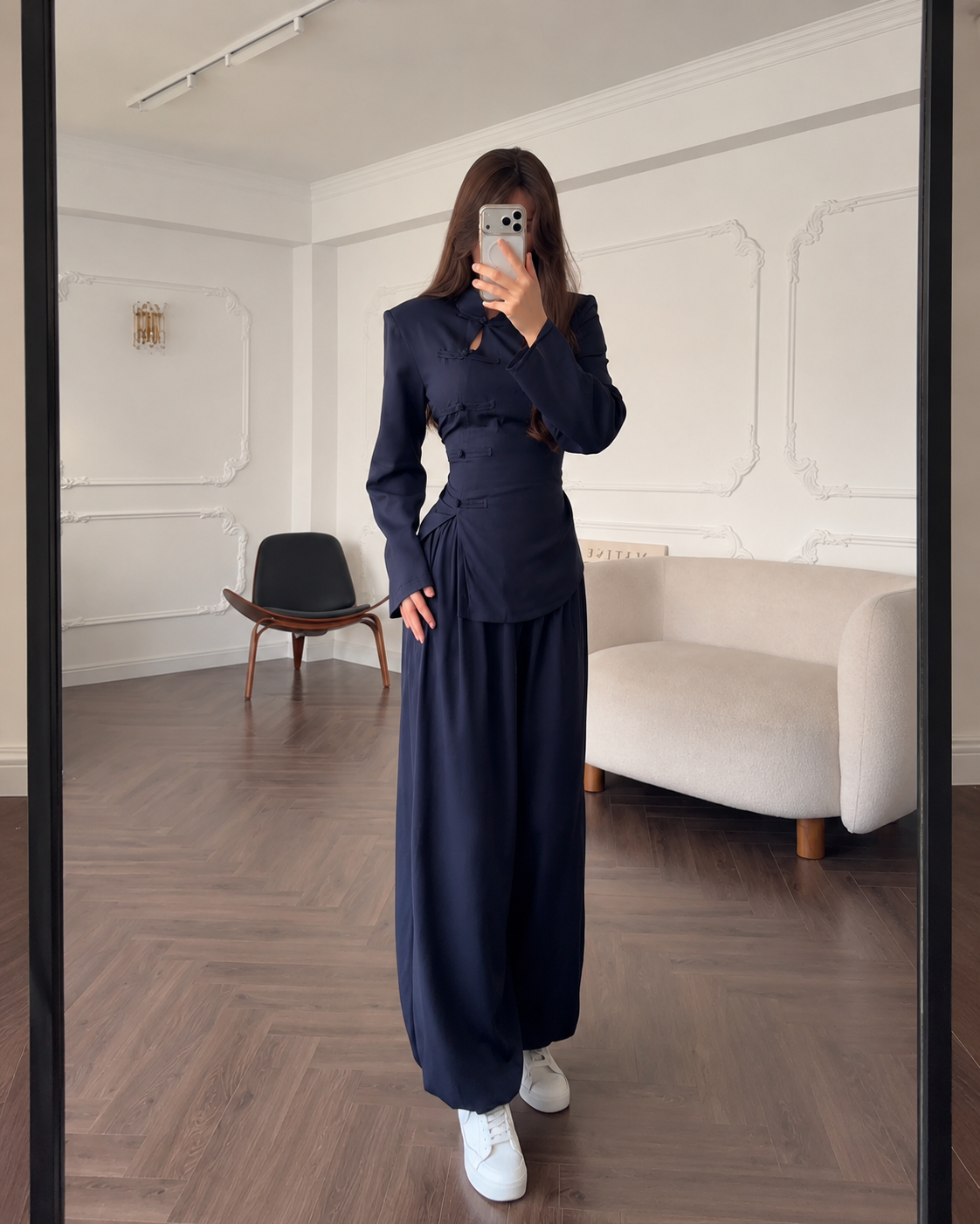 Front view of a navy two-piece set with fitted mandarin collar top and wide leg pants