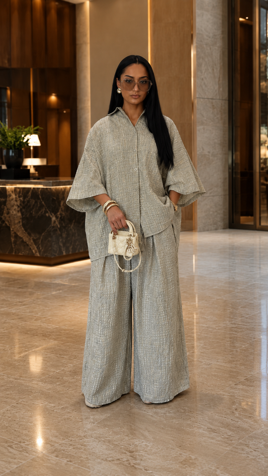 Front view of oatmeal textured two-piece set with oversized shirt and flowing wide leg pants
