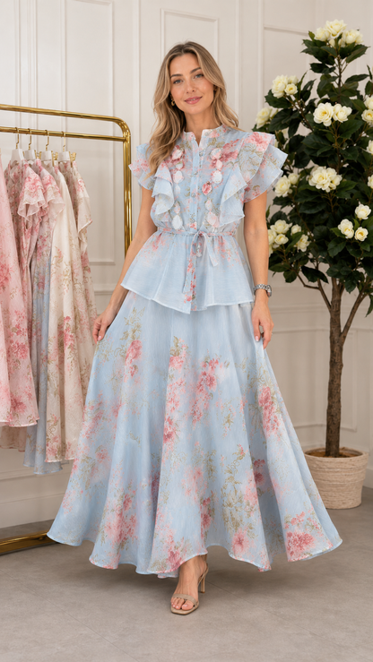 Front view of sky blue floral ruffle maxi dress with flutter sleeves and full skirt