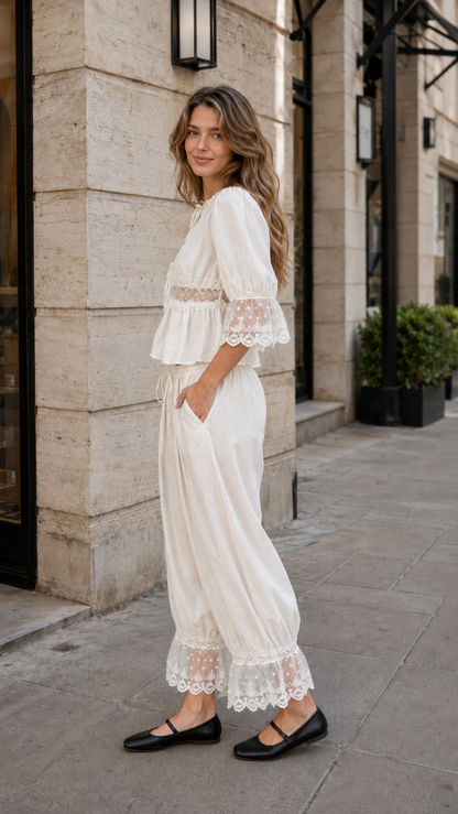 Cream lace trim peplum blouse and matching pants side view