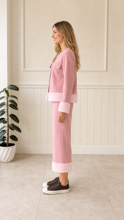 Side full-length view of pink button-up jacket and cropped pants two-piece set