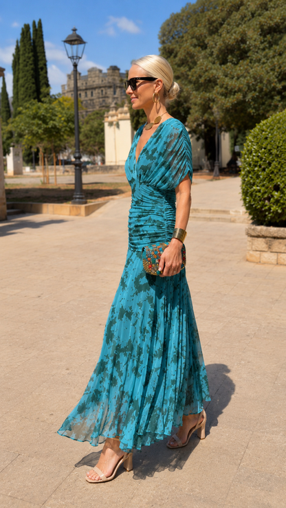 Side view of teal draped short sleeve pleated midi maxi dress