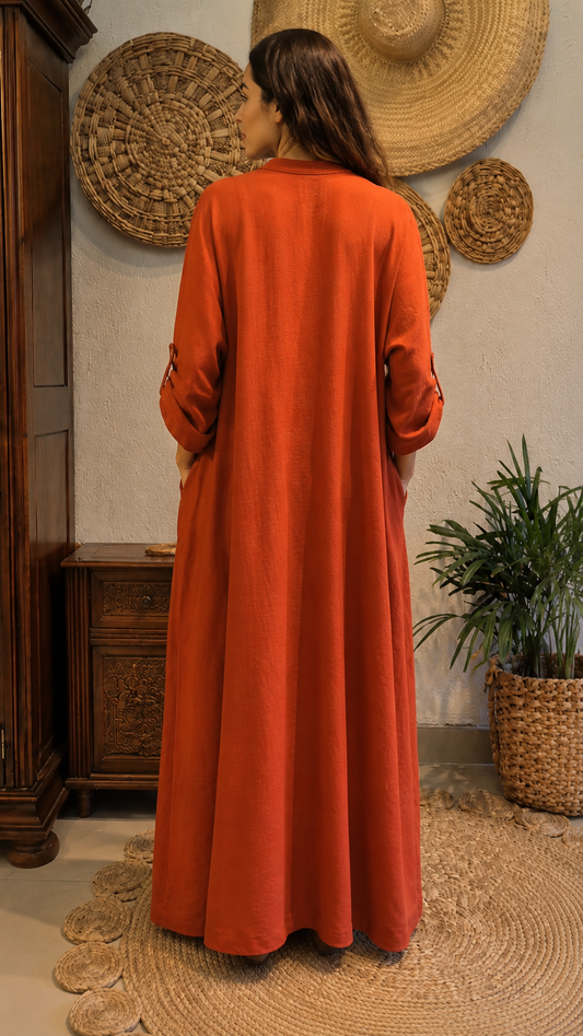 Back view of rust full-length loose kaftan dress with long sleeves