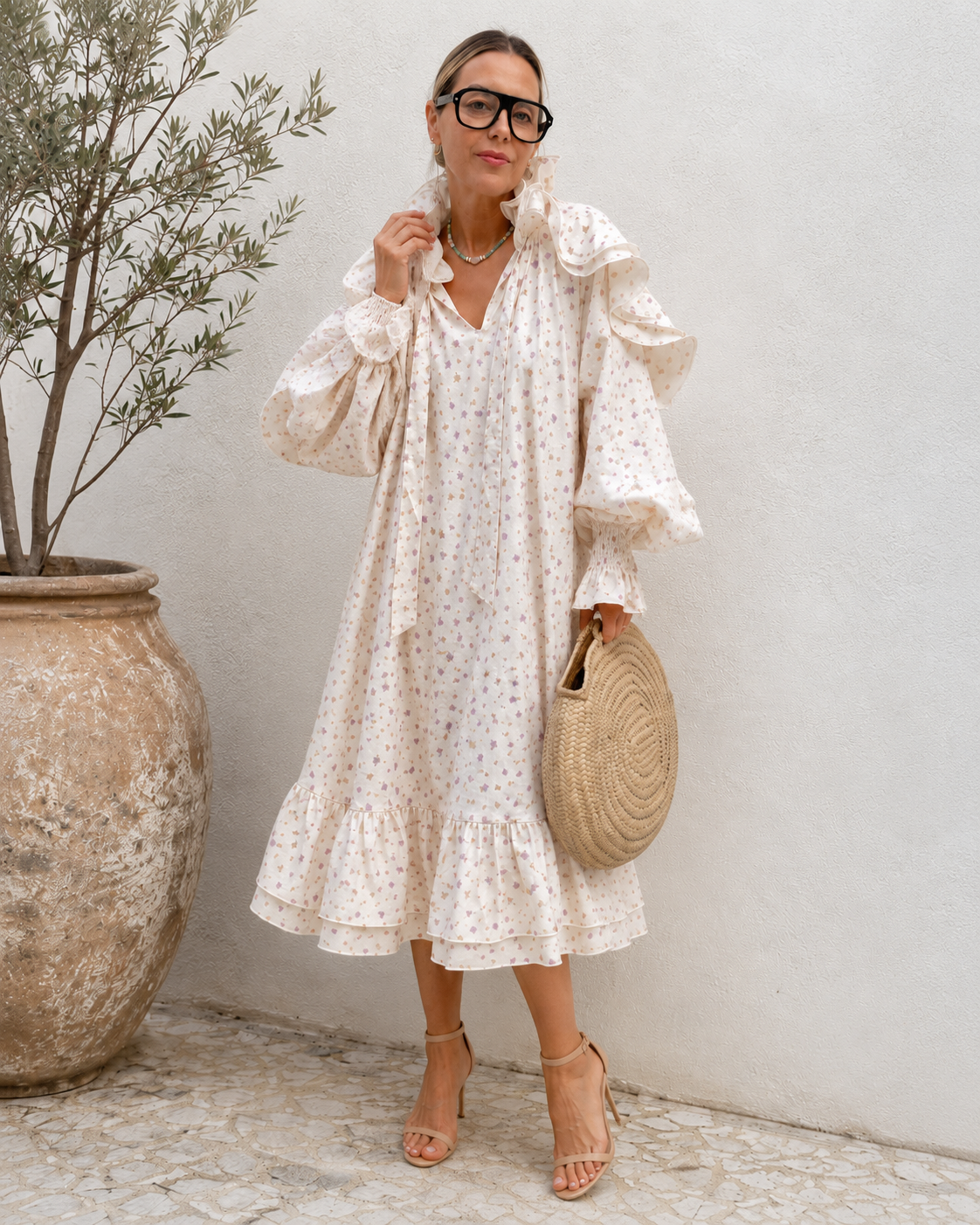 Cream floral midi dress with tie neckline and ruffle hem front angle view