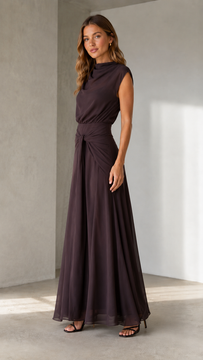 Angled front view of espresso brown sleeveless maxi dress with soft draped neckline and waist detail