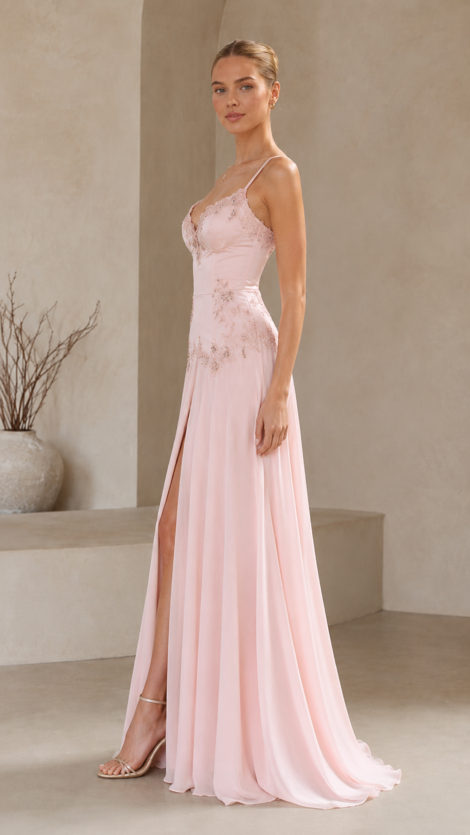 Side view of blush pink fitted formal maxi dress with spaghetti straps