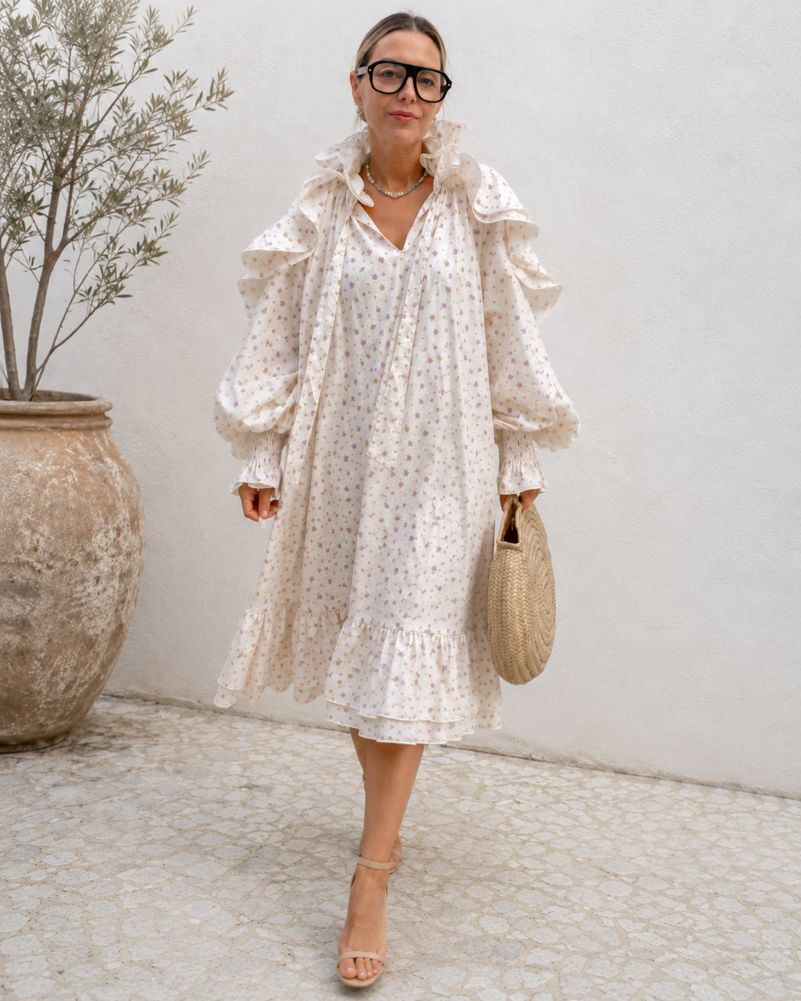 Full front view of cream floral relaxed fit midi dress with layered ruffles