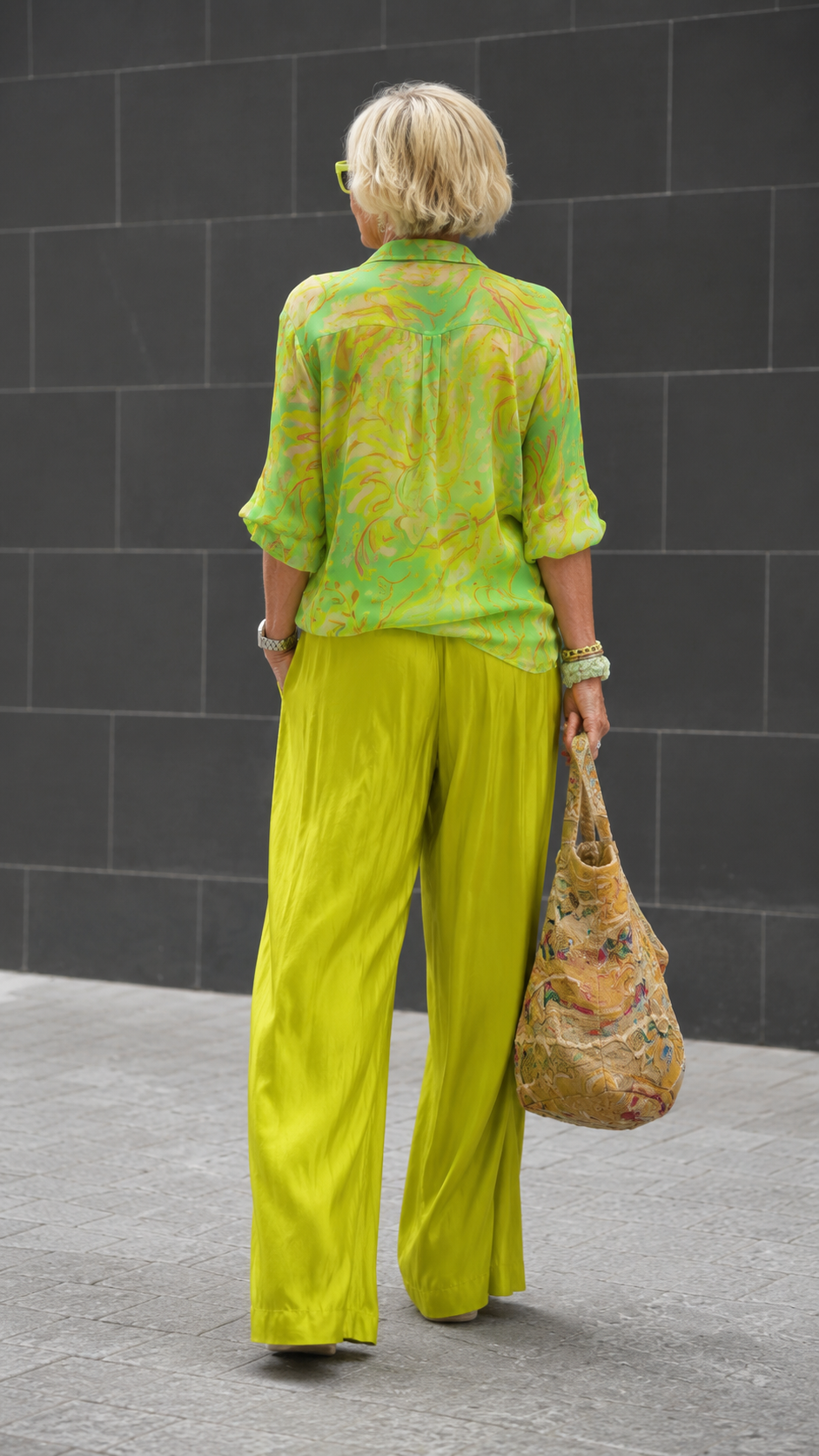 Back view of lime printed blouse and flowing pants set
