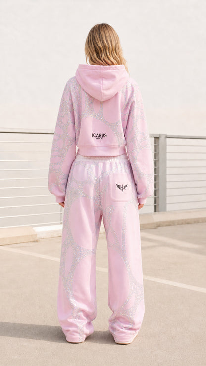 Back view of model wearing pink embellished tracksuit set