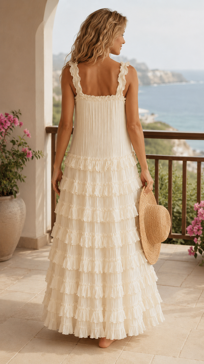 Back view of cream tiered maxi dress with ruffled straps and gathered upper back