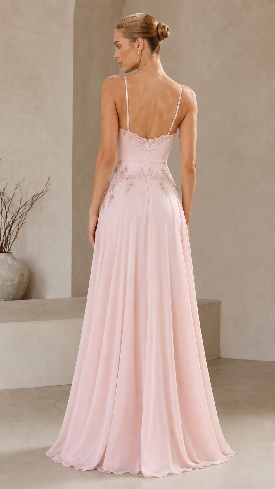 Back view of blush pink floor-length evening dress with delicate straps
