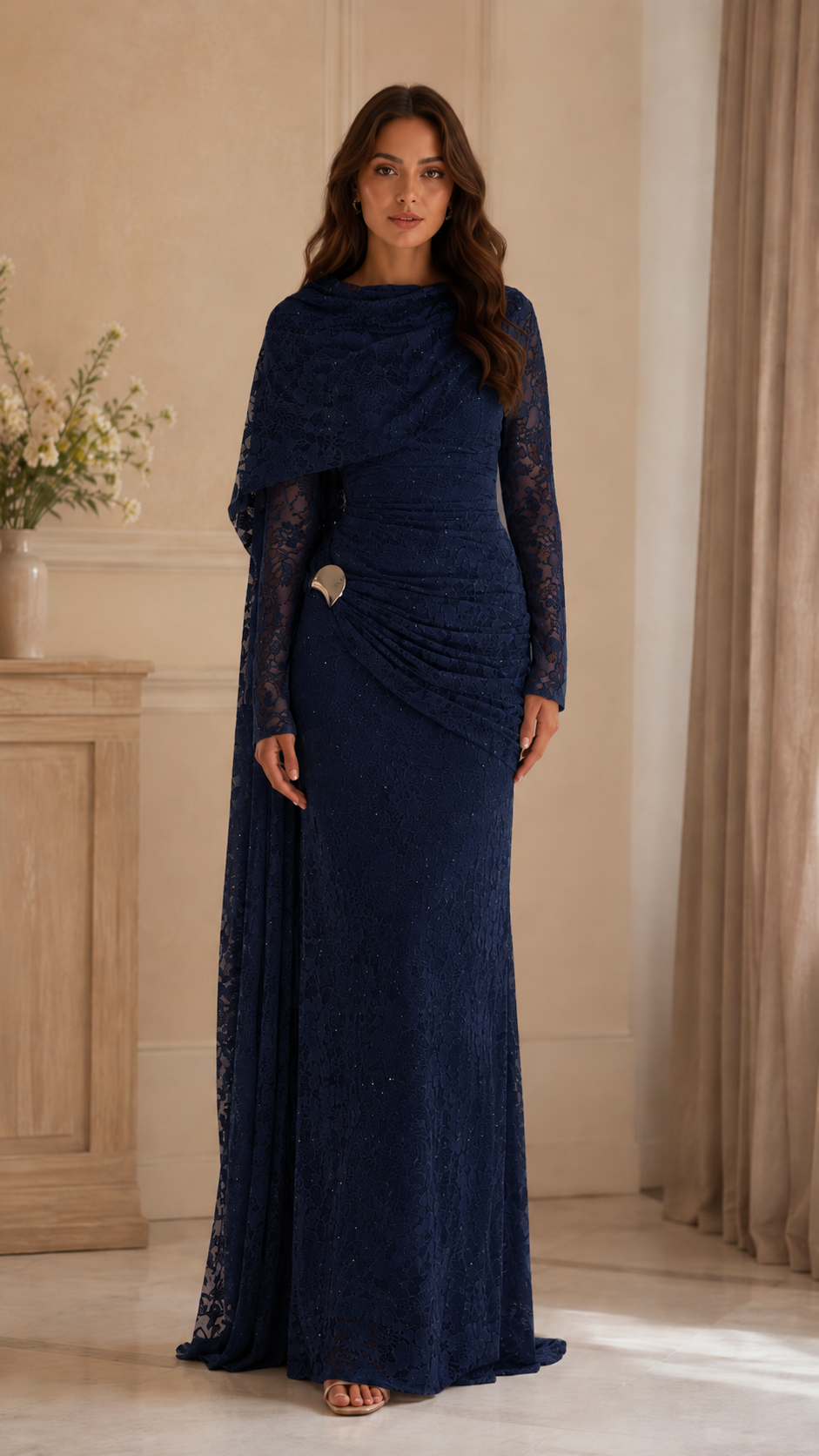 Front view of navy lace floor-length formal dress with long sleeves and cape-style overlay