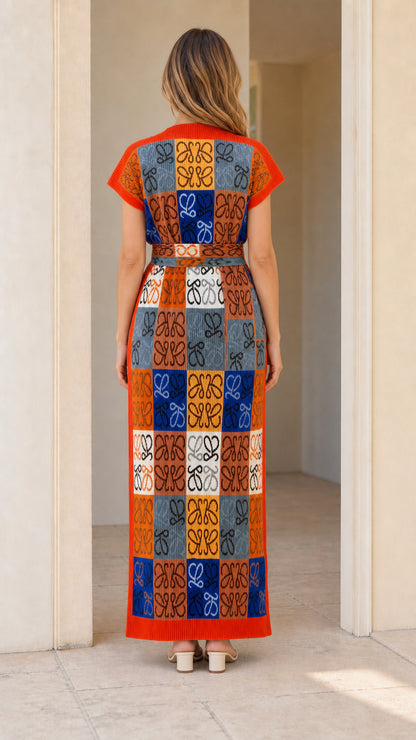 Back view of model wearing Orange Multi geometric pattern knit maxi dress