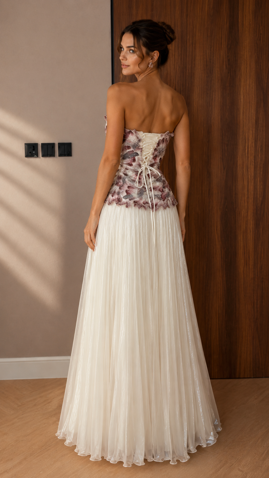 Back view of mauve and ivory evening dress with lace-up back and full tulle skirt