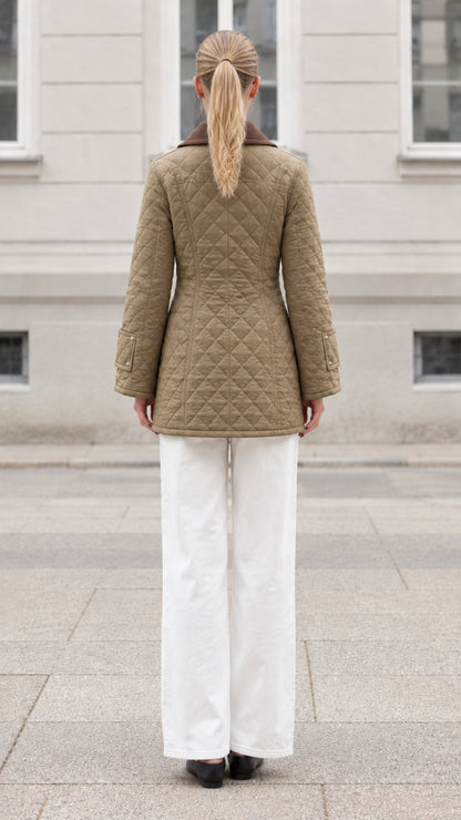 Back view of woman wearing khaki mid-length diamond quilted jacket