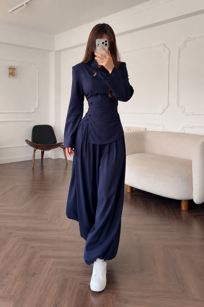 Full-length front walking view of the navy matching set with fluid wide leg silhouette