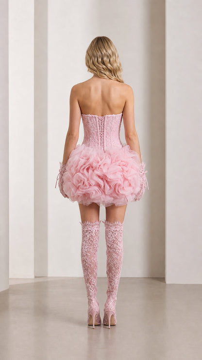 Back view of pink lace corset mini dress showing adjustable lace-up back detail