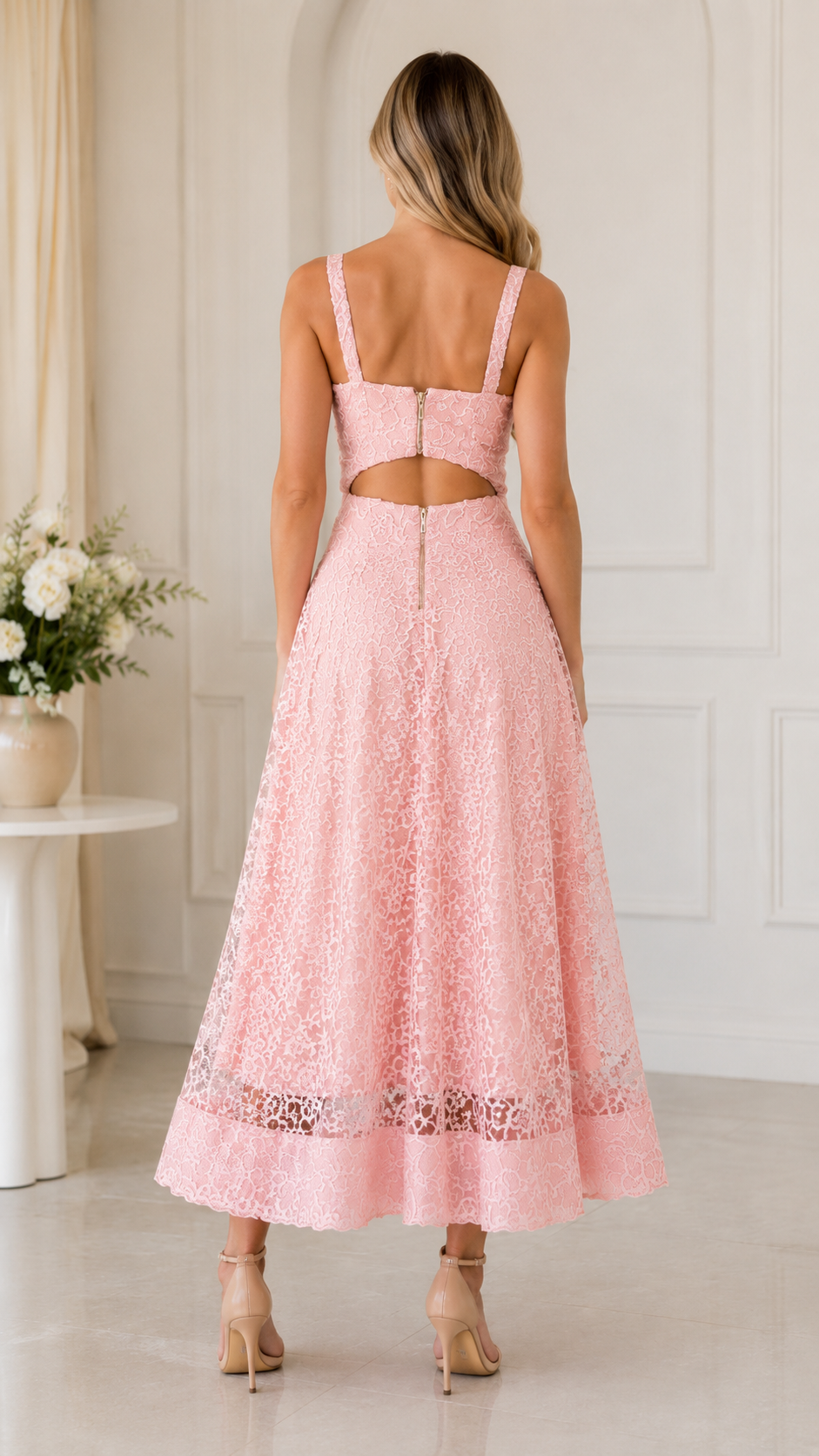 Back view of blush pink lace dress showing cutout back detail and long skirt