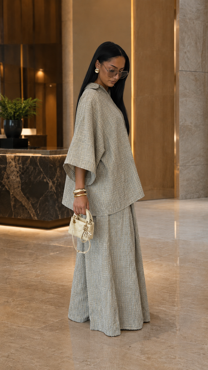 Side view of oatmeal textured shirt and wide leg pants matching set
