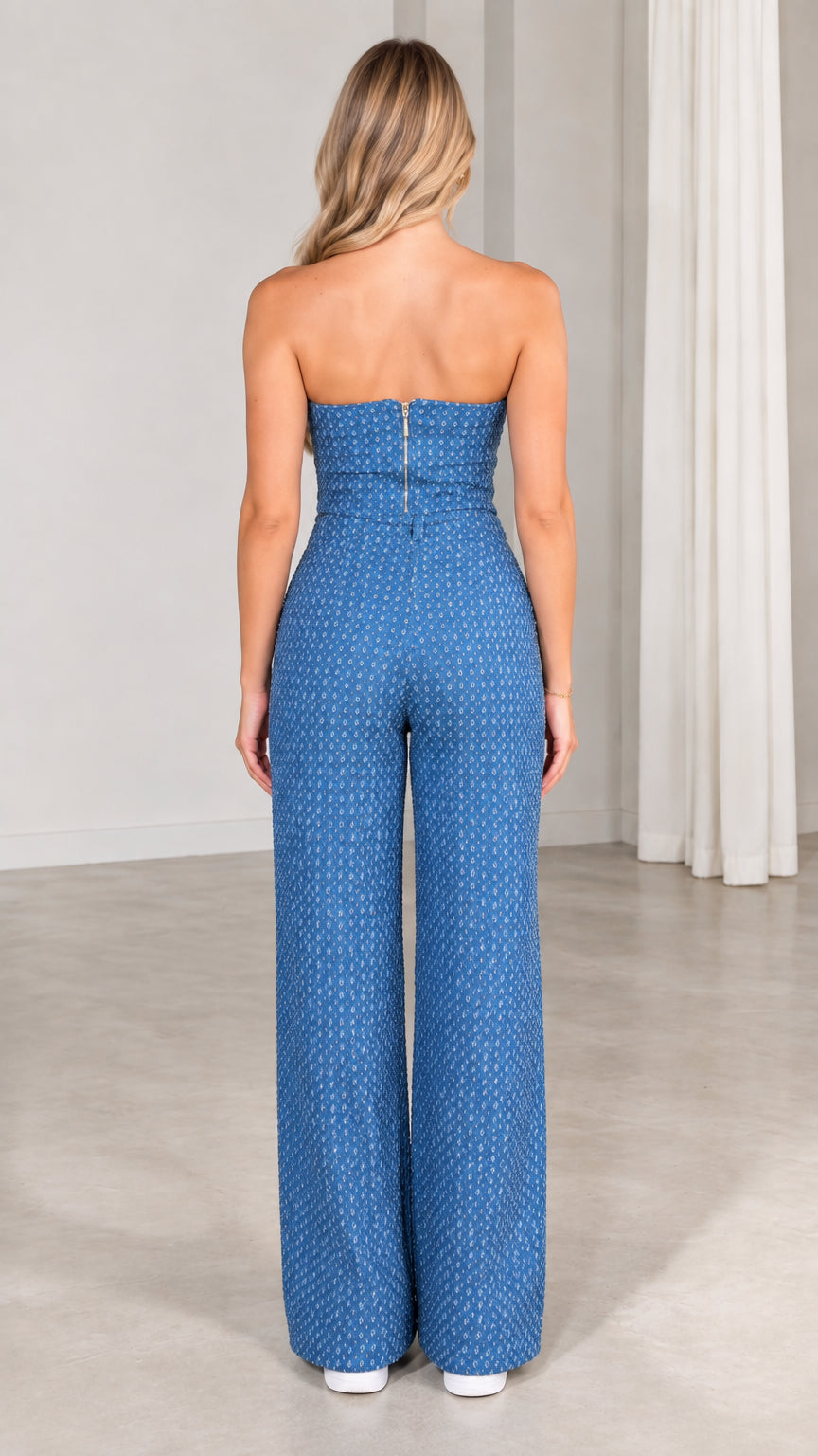 Back view of model wearing blue strapless sequin top showing rear zipper and wide leg pants