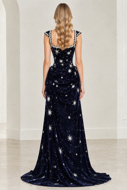 Back view of navy blue velvet evening gown with star embroidery