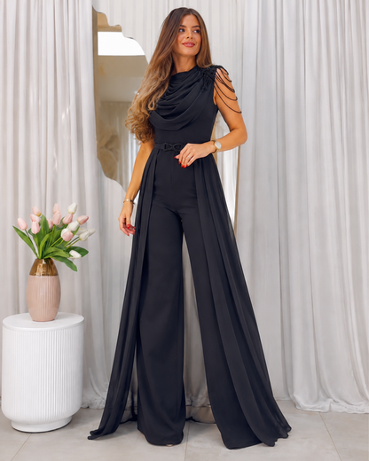 Full front angle of black sleeveless wide leg jumpsuit with waist detail
