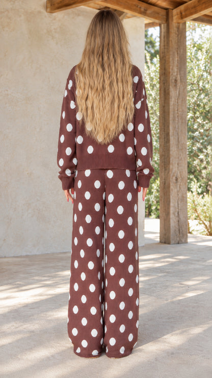 Back view of model wearing brown polka dot wide-leg knit lounge set