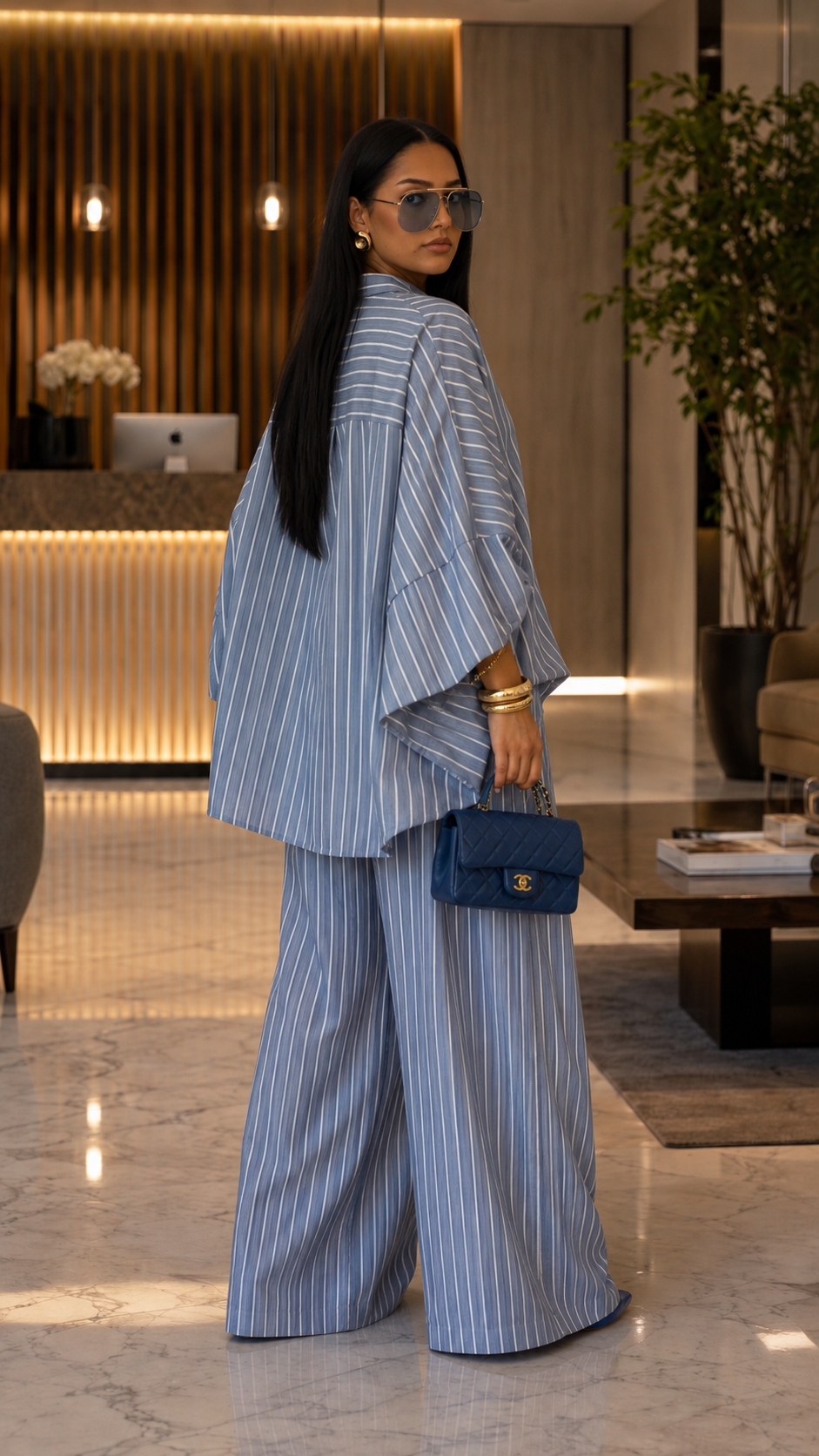 Back view of dusty blue striped oversized shirt and wide leg pants set