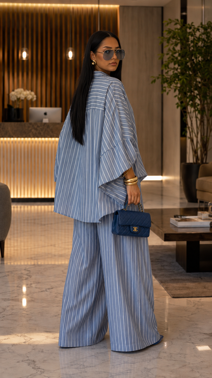 Back view of dusty blue striped oversized shirt and wide leg pants set