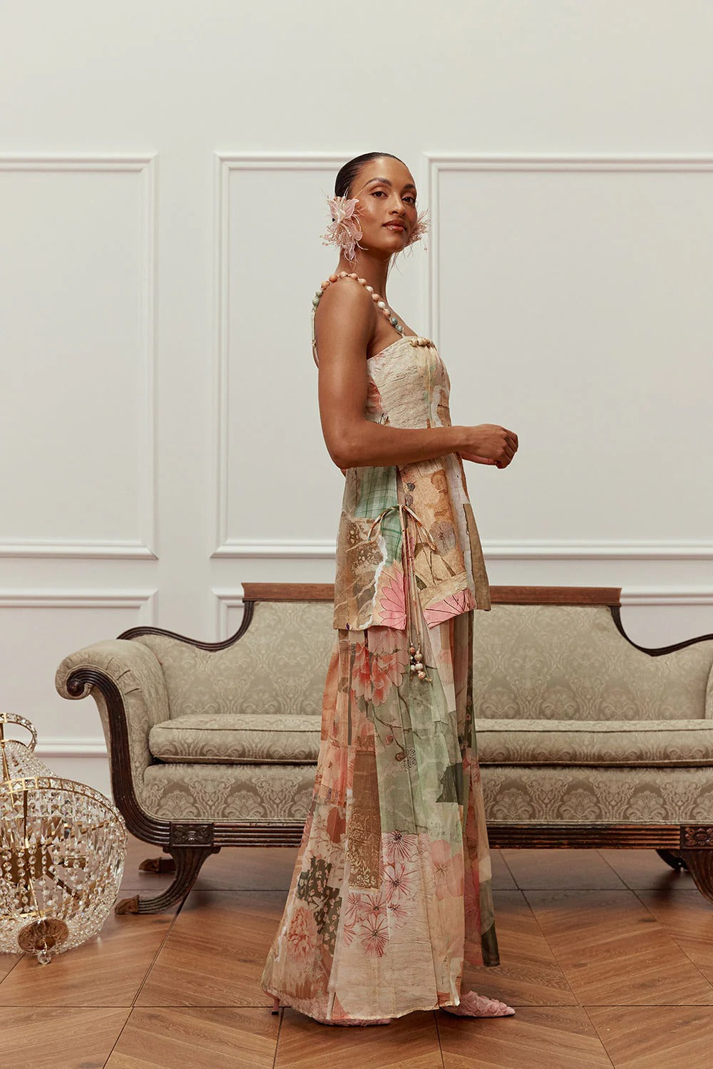 Side view of the sleeveless pastel maxi dress with layered flowing silhouette