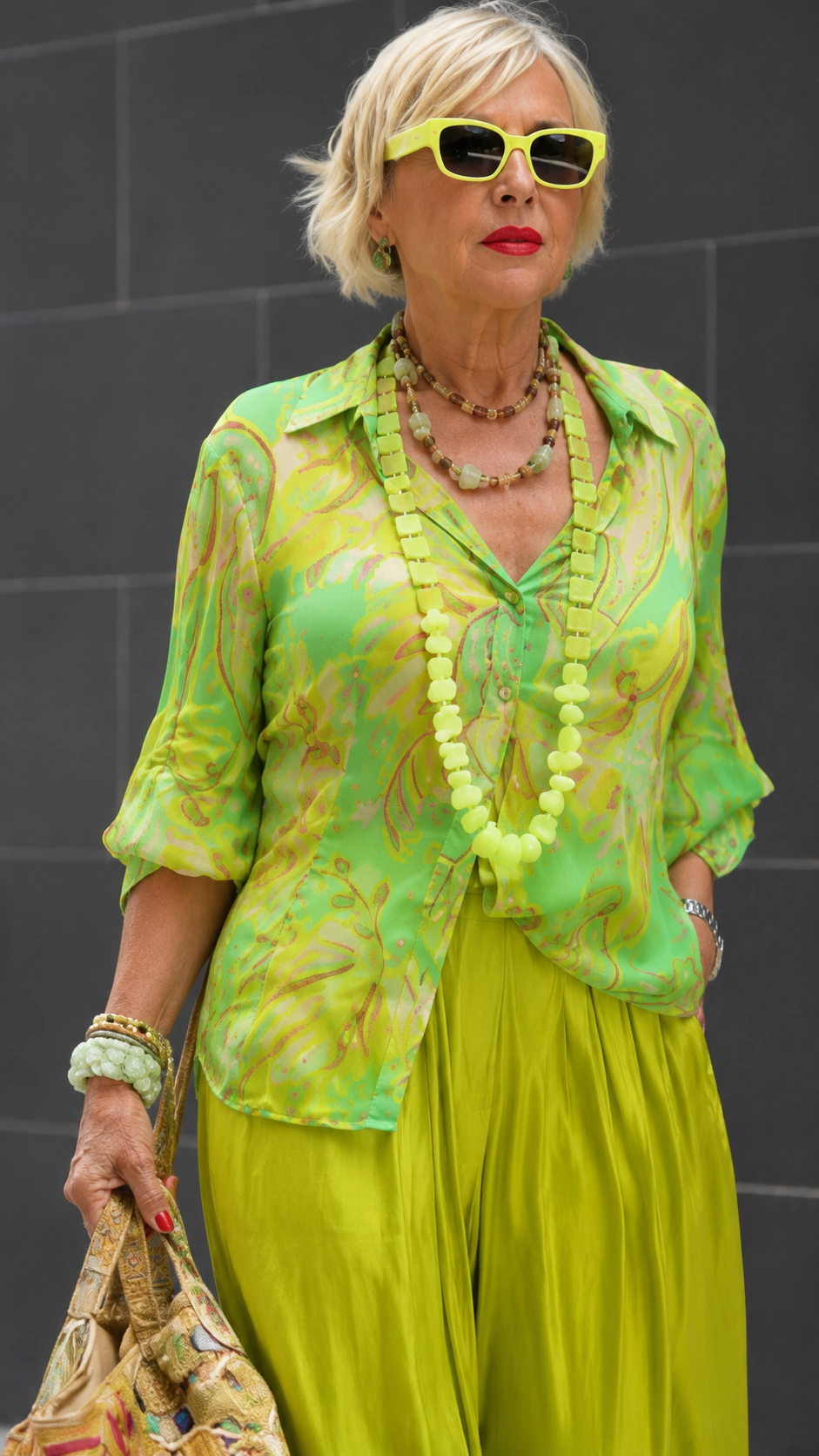 Close-up of lime printed collared blouse with rolled sleeves