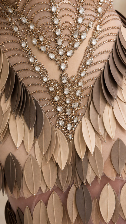 Close up of rhinestone embellishments and leaf applique fringe detailing