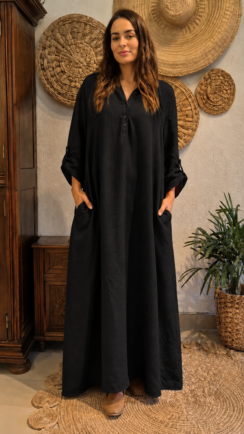 Front view of black relaxed maxi kaftan dress with pockets