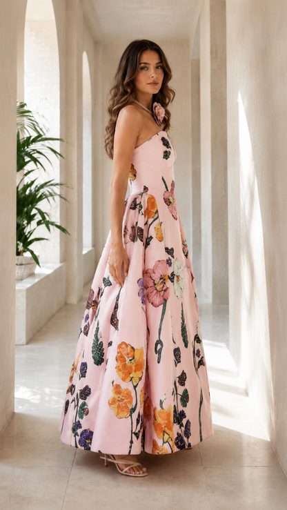 Side view of blush pink floral maxi ball gown with full structured skirt