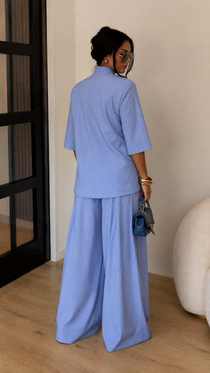 Back view of sky blue two-piece set showing relaxed top and full-length wide-leg pants