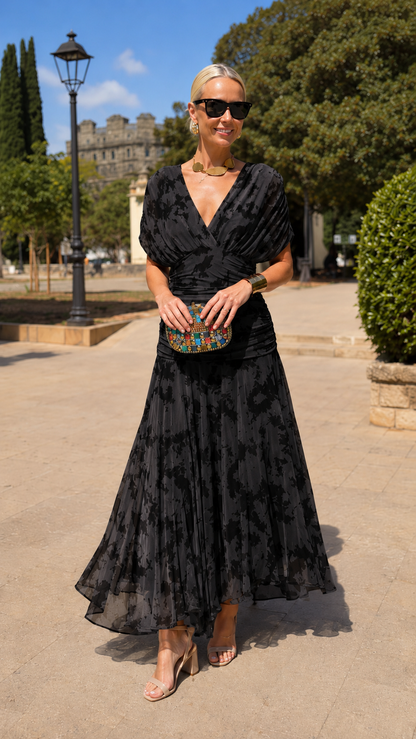 Front view of black ruched V-neck pleated occasion dress