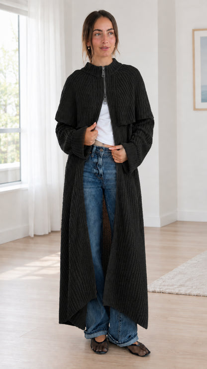Front view of black ribbed knit longline capelet cardigan duster coat