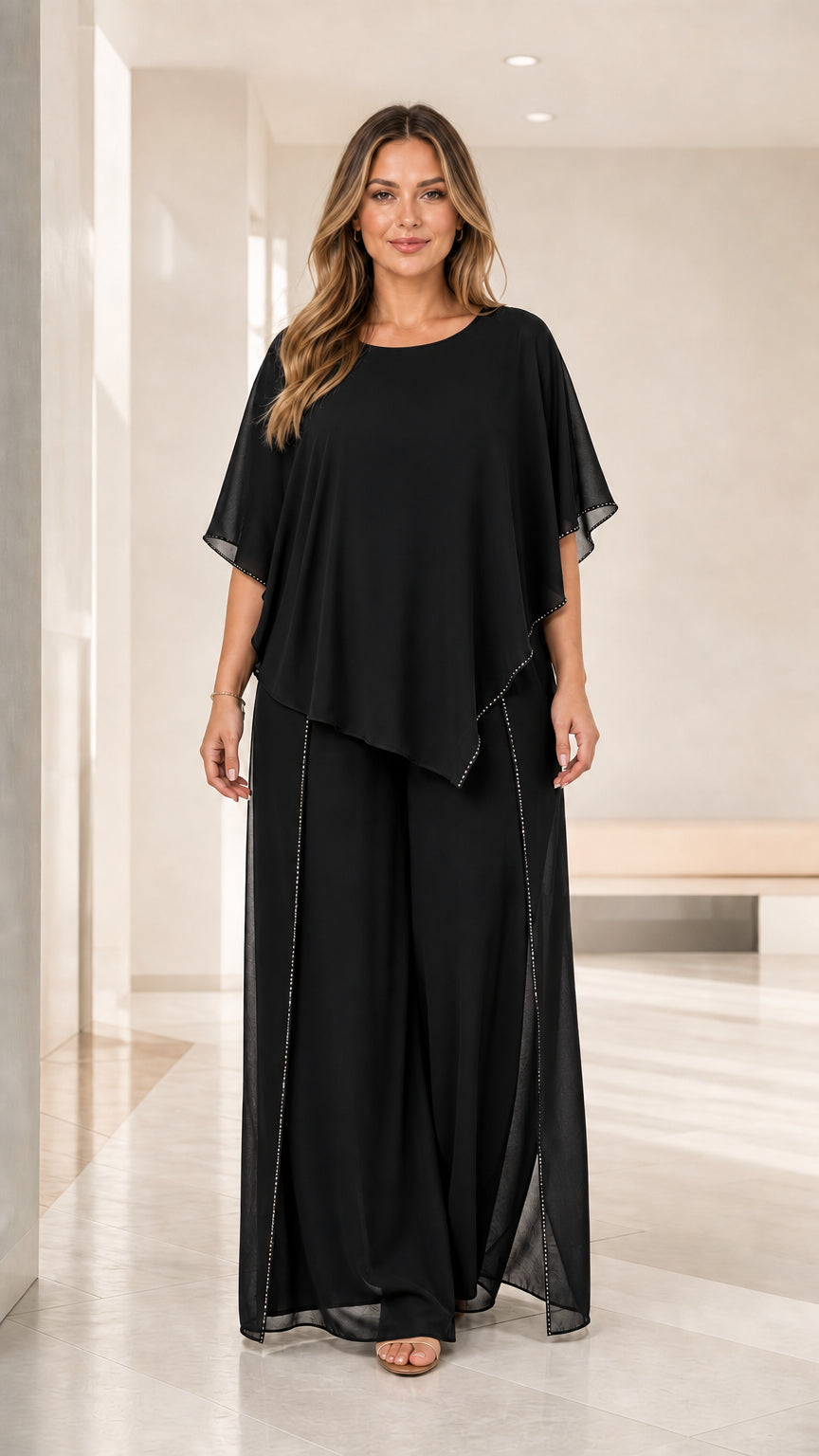 Full front view of the black chiffon capelet and wide leg pants evening set