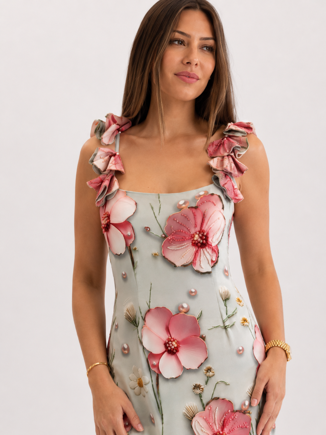Close-up of square neckline and ruffle straps on pink floral maxi dress