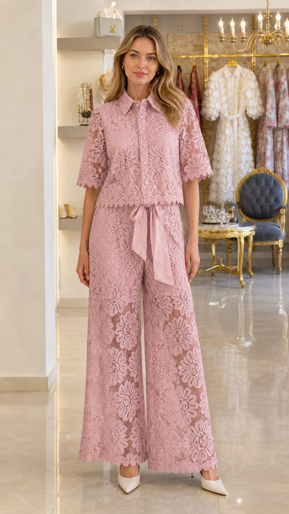 Model wearing dusty pink floral lace short-sleeve shirt and wide-leg trousers set